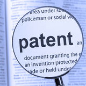 patent-highlighted-thru-magnifying-glass-46669316