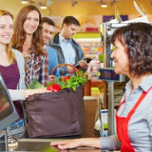 woman-waiting-line-supermarket-checkout-groceries-47155916