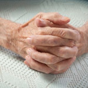 care-home-elderly-old-people-holding-hands-closeup-39773934