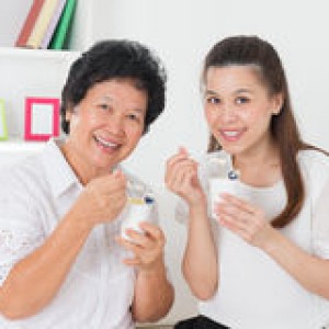 http://www.dreamstime.com/stock-photos-women-eating-yogurt-happy-asian-family-yoghurt-home-beautiful-senior-mother-adult-daughter-healthcare-concept-image32902473